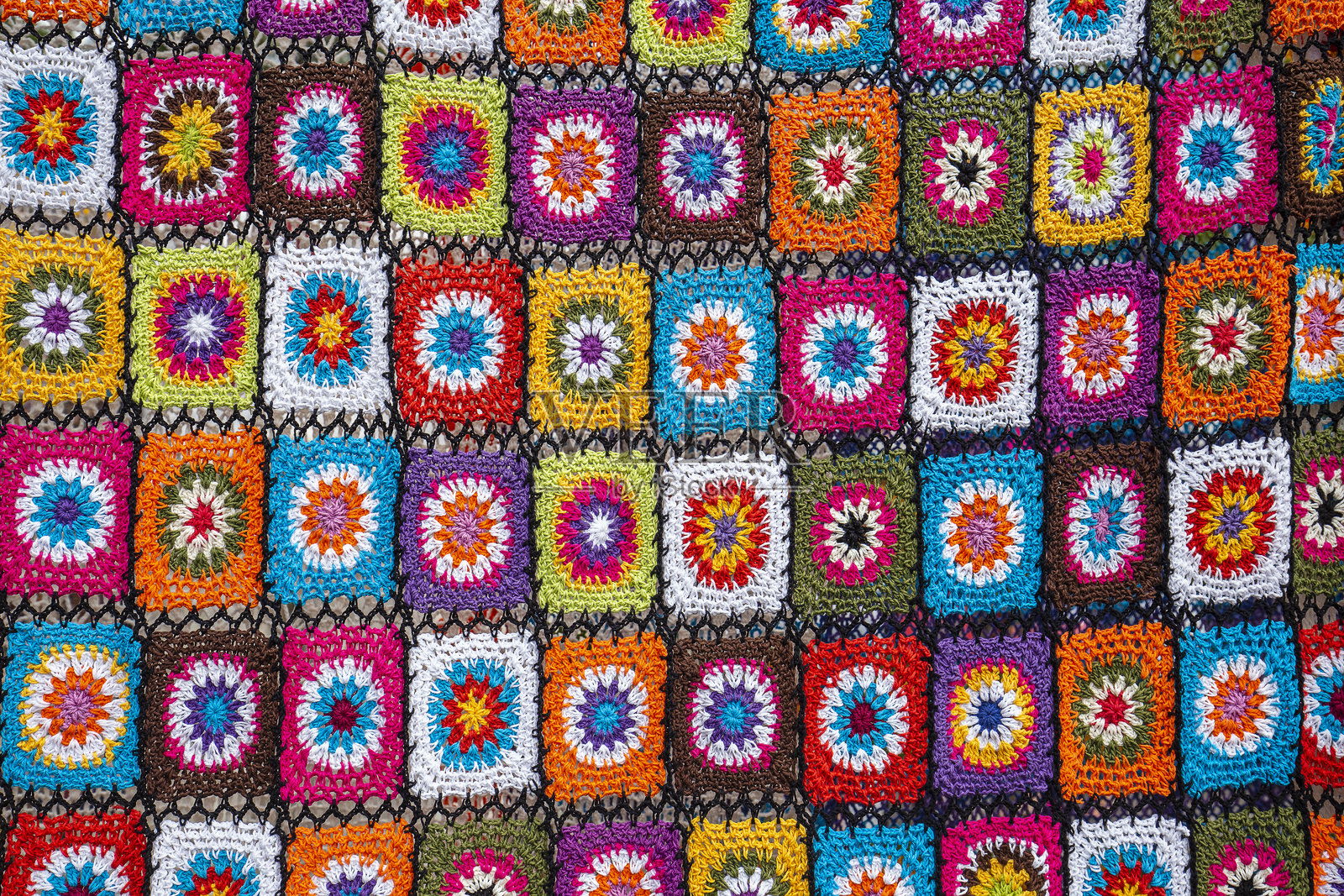 在印度尼西亚巴厘岛乌布的街市上出售的五彩缤纷的巴厘装饰毯照片摄影图片