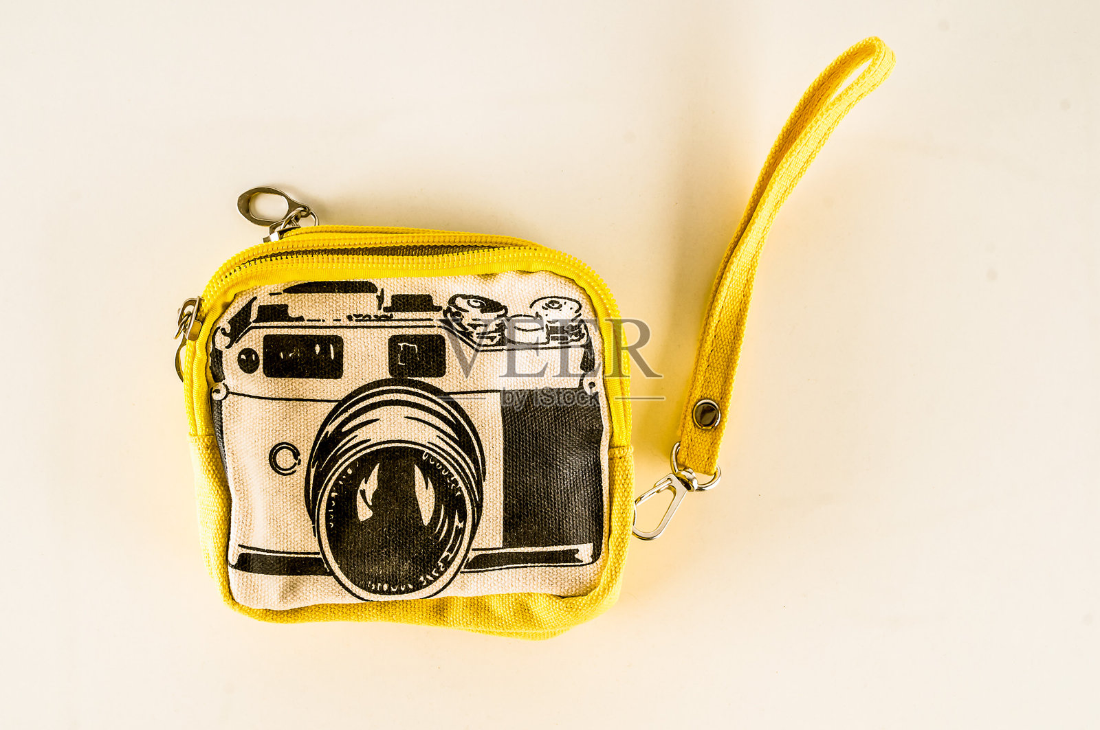 一个黄色的相机包，上面有一个黑色的相机照片摄影图片