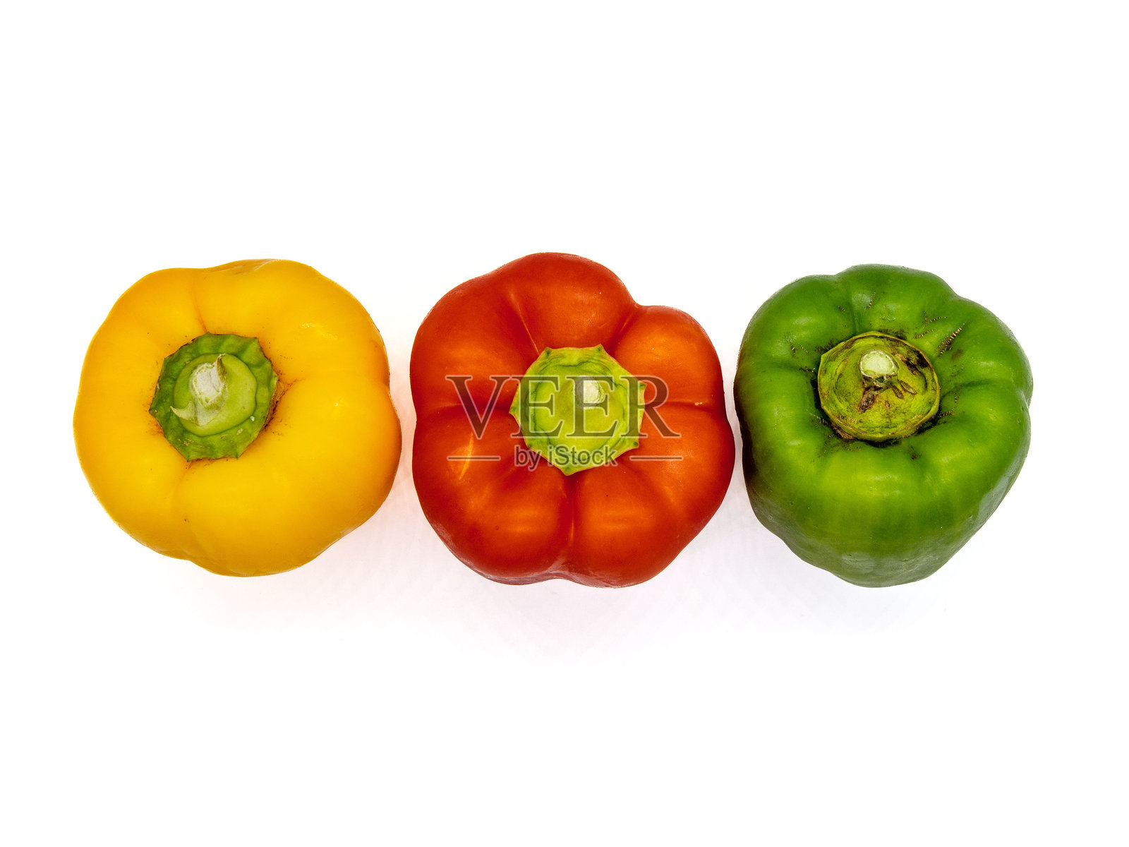 五彩缤纷的甜椒在白色背景上照片摄影图片