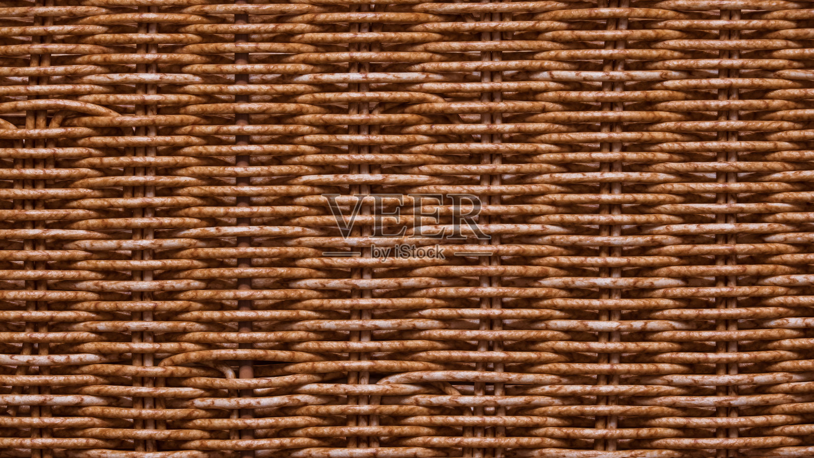 天然柳条编织的篮子墙壁特写。背景。图案。纹理。照片摄影图片