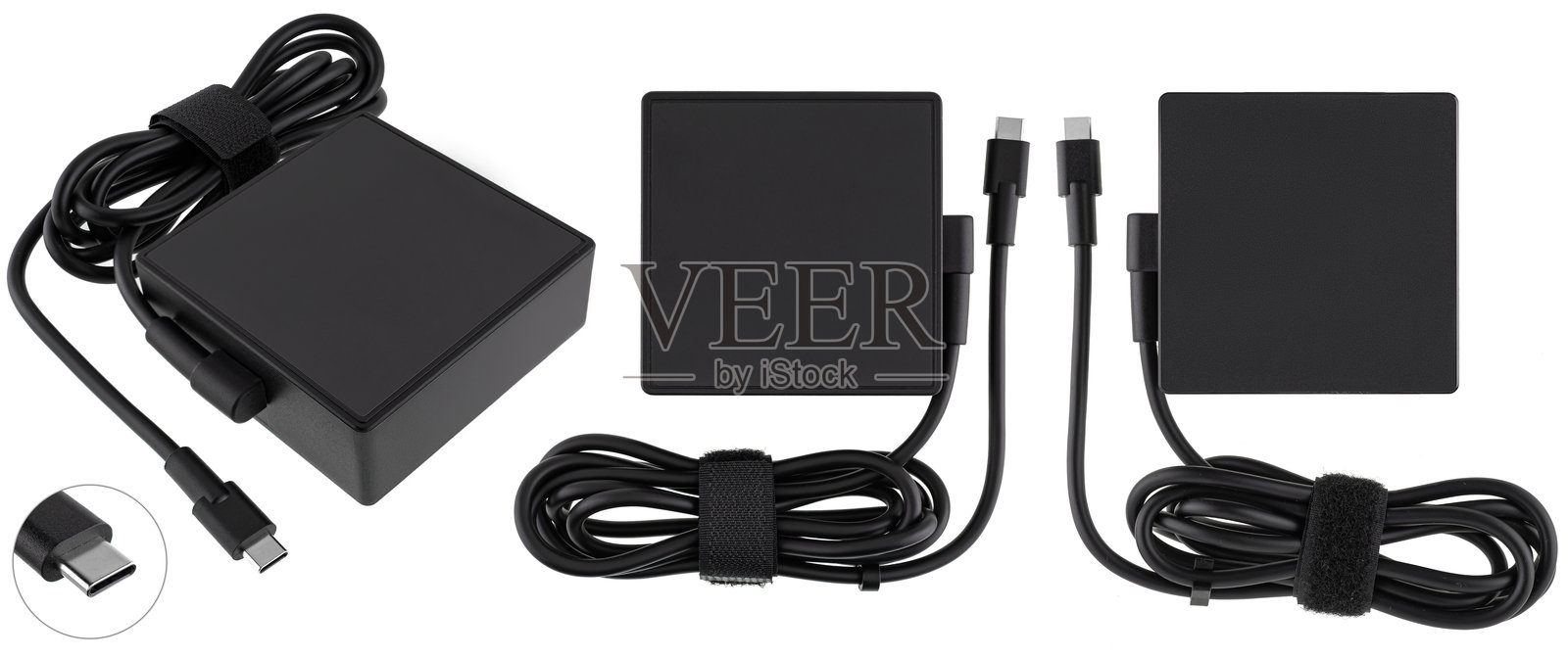 白色背景上的紧凑型笔记本电脑充电适配器。照片摄影图片