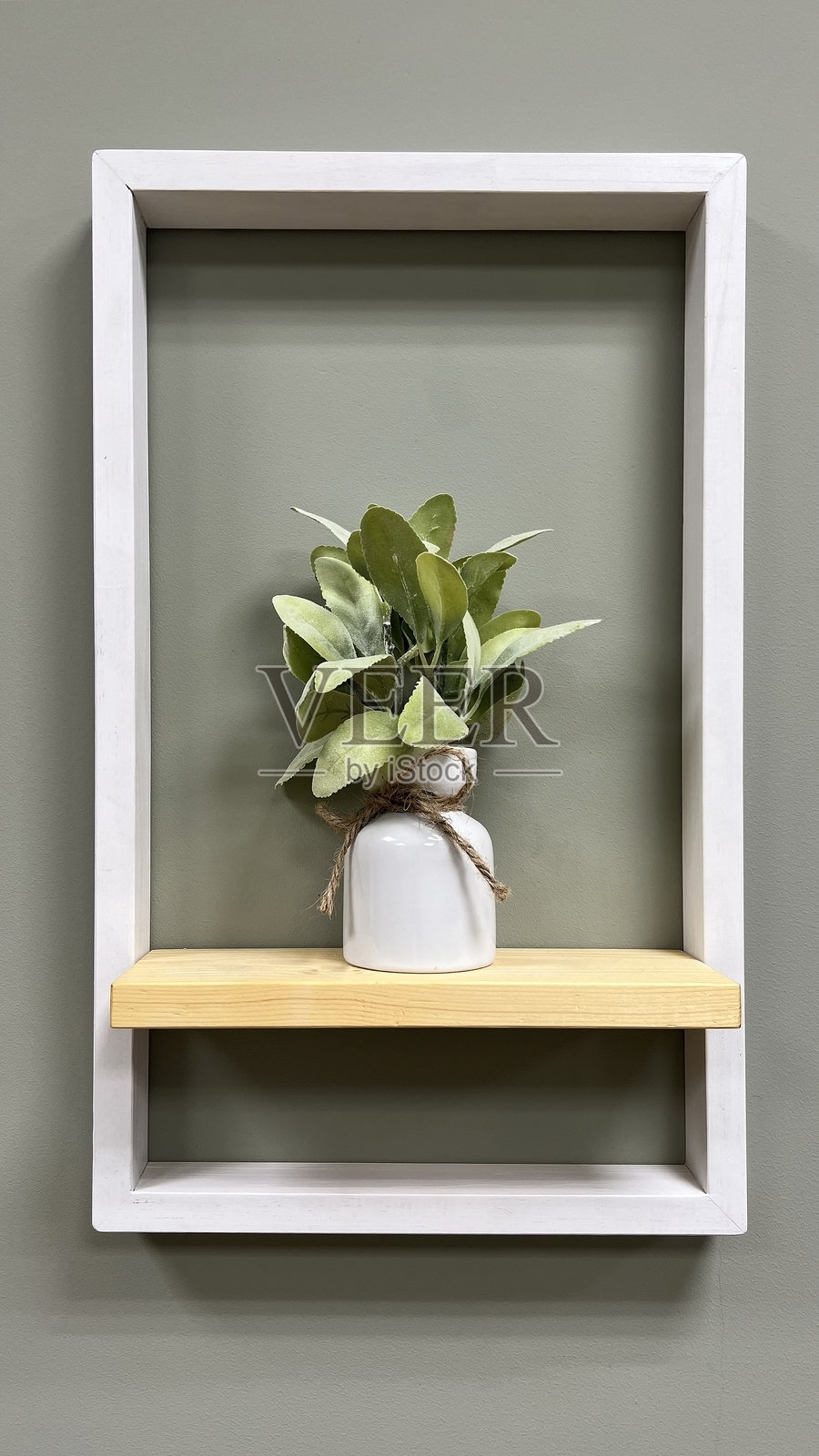 装饰性室内墙面设计 - 带有花盆架的框架。照片摄影图片