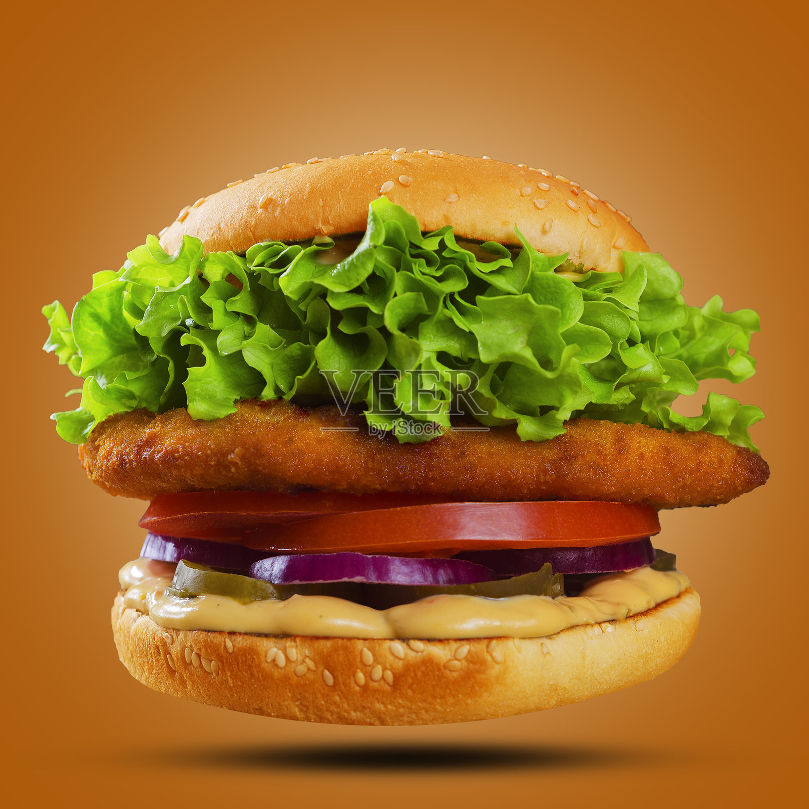 美味的汉堡在橙色背景上照片摄影图片
