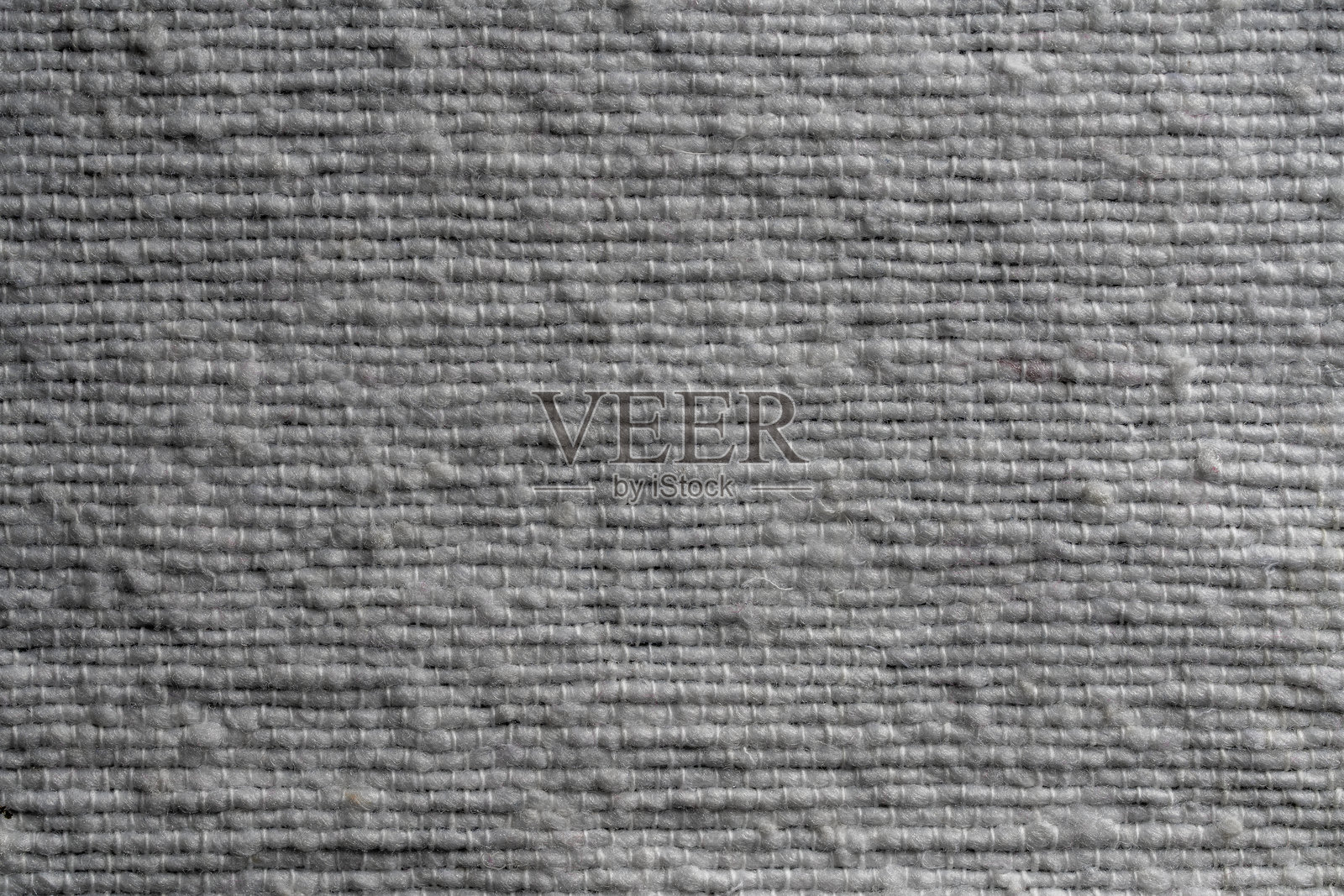 白色天然生态面料的纹理特写。白色粗糙面料的背景。照片摄影图片