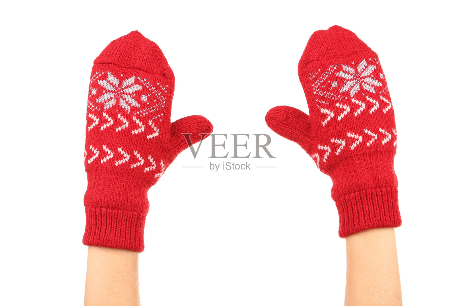 白色背景上的手戴着针织手套照片摄影图片