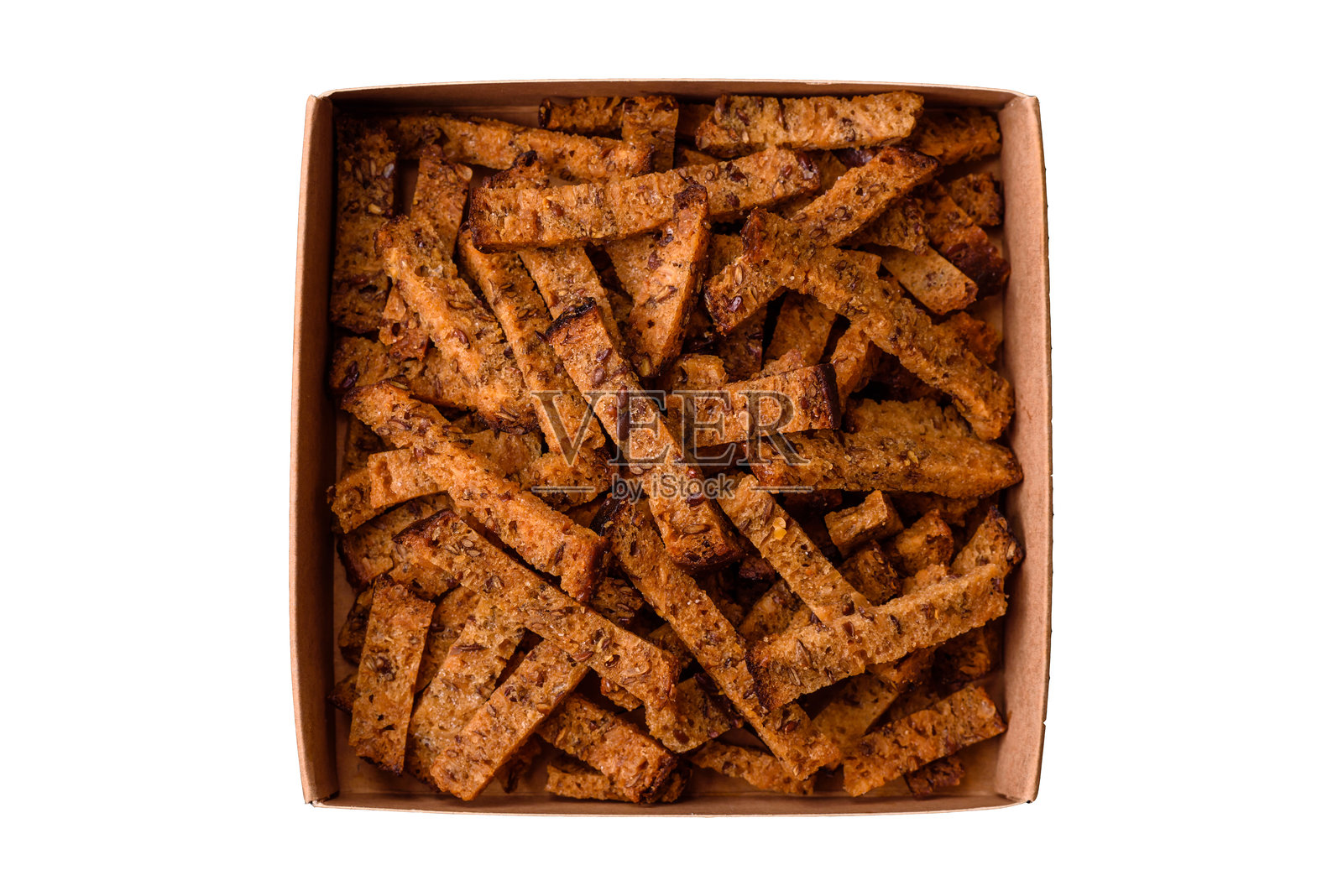 自制的脆皮棕色面包饼干或烤面包丁，配有种子和谷物照片摄影图片