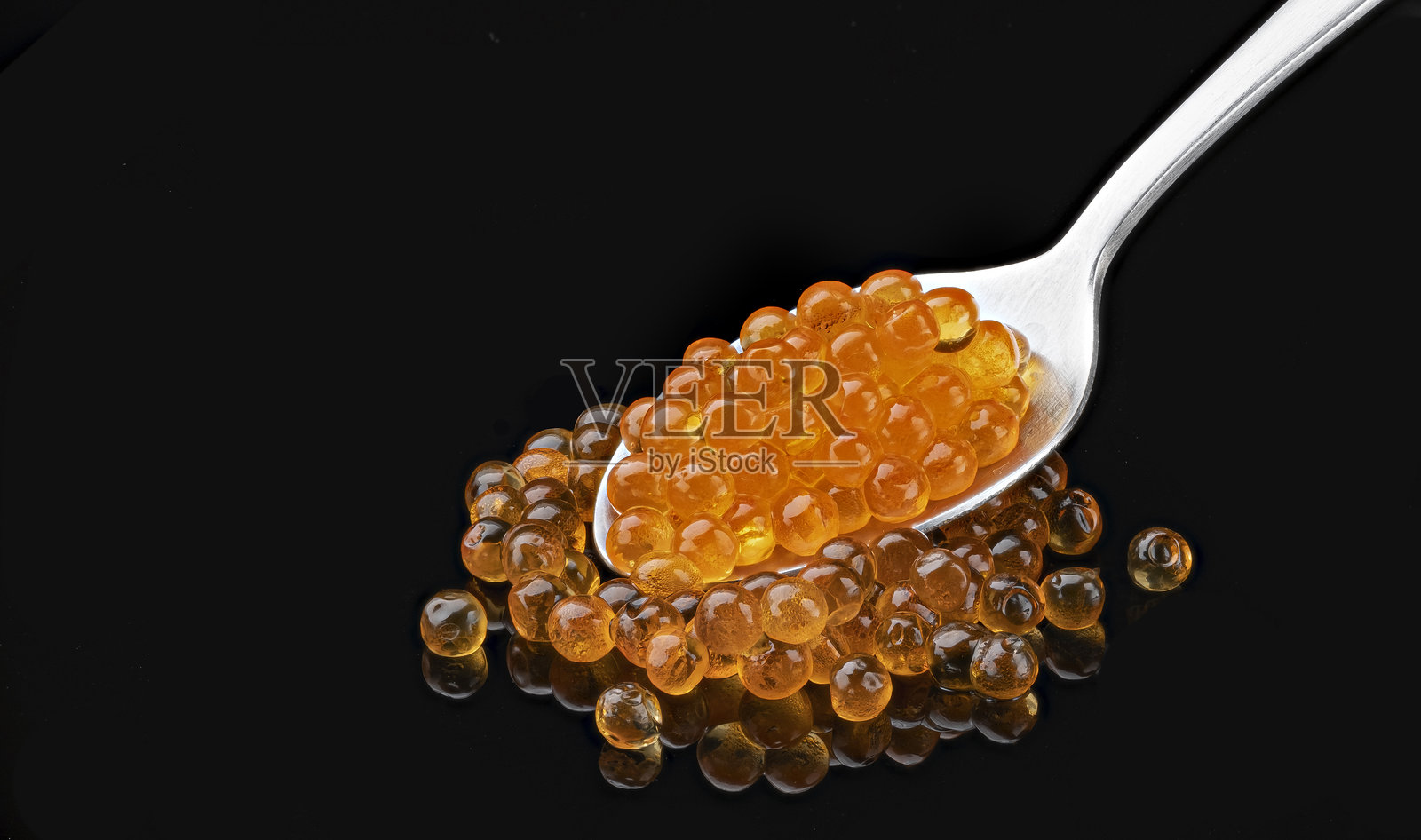 红鱼子酱的勺子，包装设计元素照片摄影图片