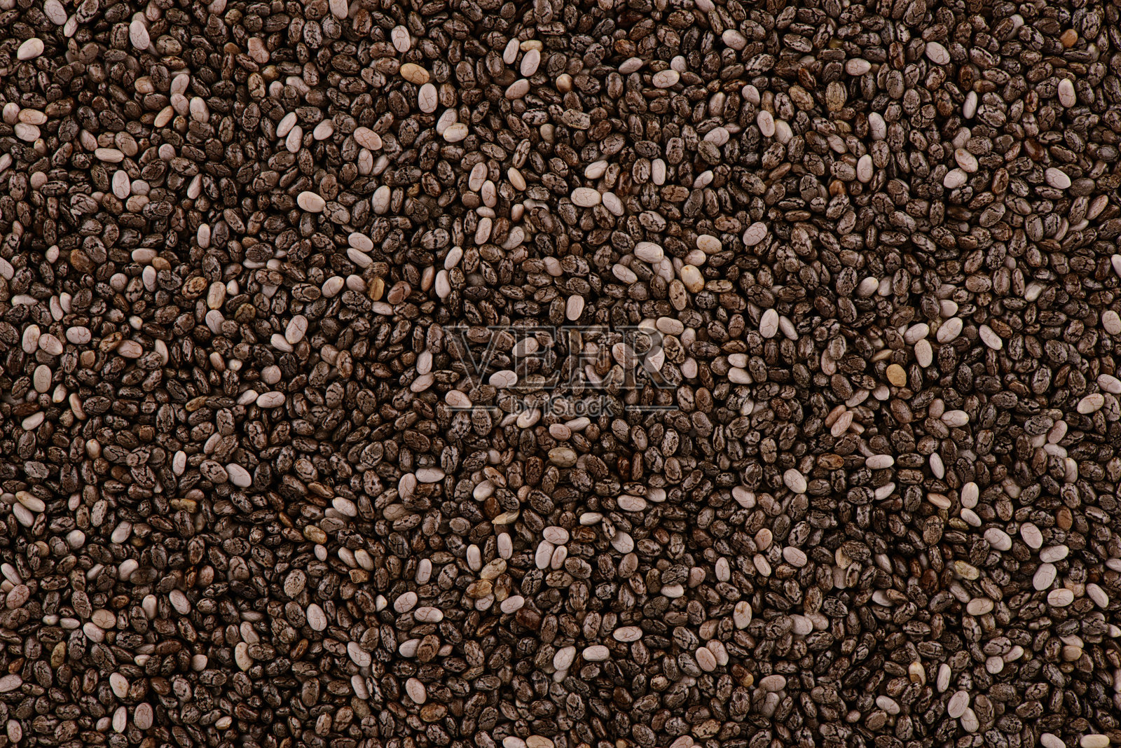 有机黑奇亚籽的特写，展示其自然的纹理和图案。照片摄影图片