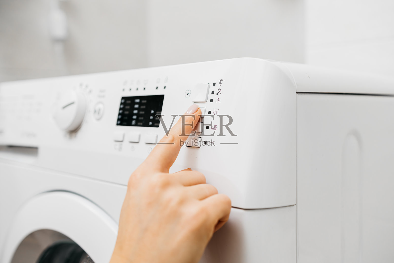 洗衣机按钮特写，准备使用。照片摄影图片