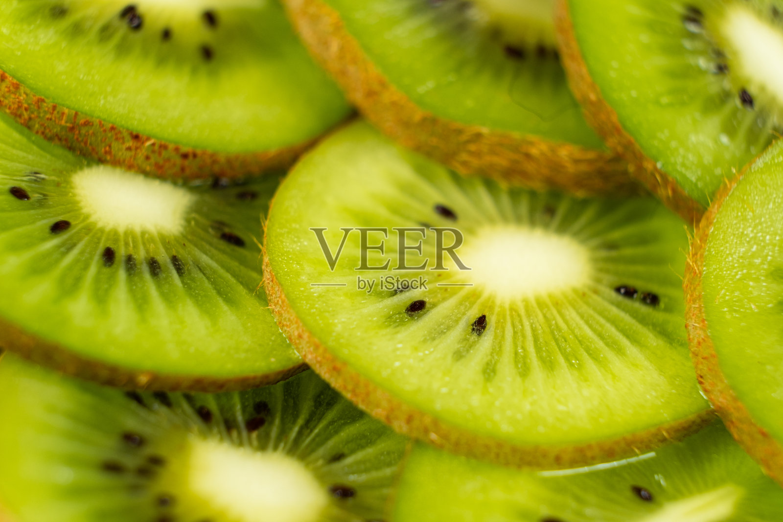 丰盈的猕猴桃特写。绿色的完美。照片摄影图片