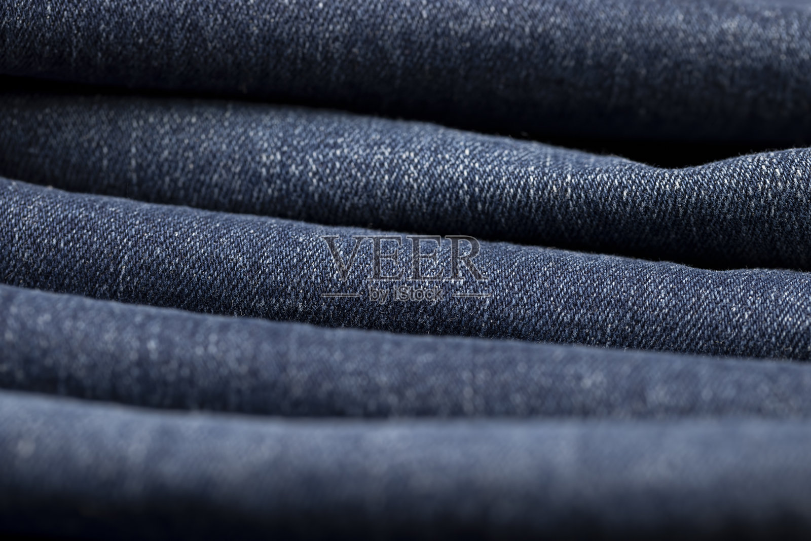 用于生产服装和其他物品的新蓝色牛仔布料照片摄影图片