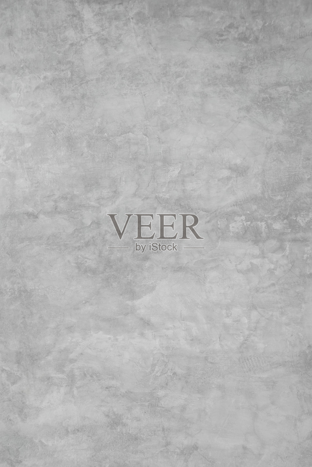 灰色装饰性灰泥或混凝土的纹理，带有裂缝。用于设计的抽象背景。水泥墙面纹理。工业风格。垂直。照片摄影图片