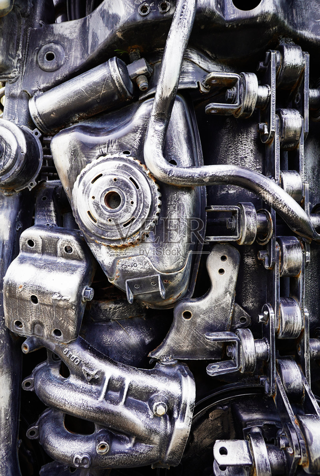 工业机器人核心部件，由旧铁和碳钢制成的机身部件。垂直。照片摄影图片