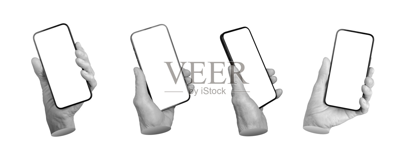 老年人手握着一部空白屏幕的智能手机。皱纹的手指紧握着移动设备，样机。照片摄影图片