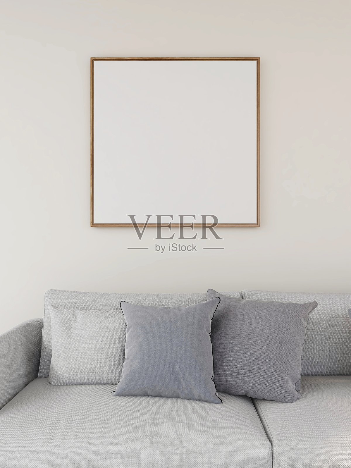 带有方形框架样板和米色沙发及靠垫的客厅照片摄影图片