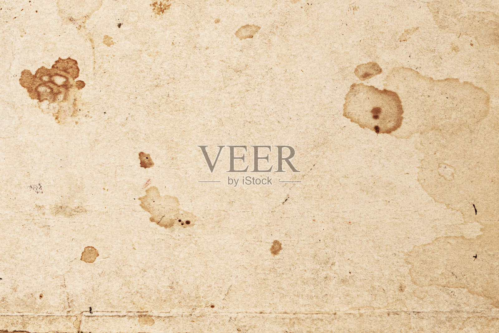 带有旧污渍和有机瑕疵的陈旧纸张。用于艺术、复古、粗糙风格设计的纹理复古背景。照片摄影图片