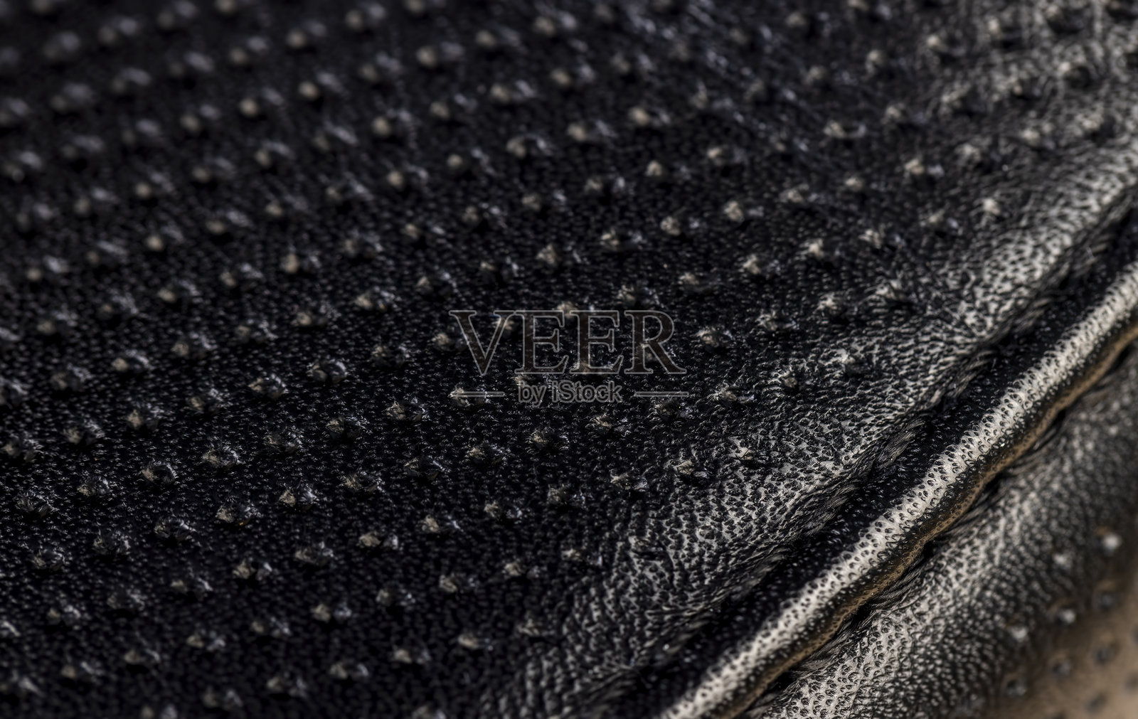 经过处理的皮革，带有穿孔以展现美丽外观照片摄影图片