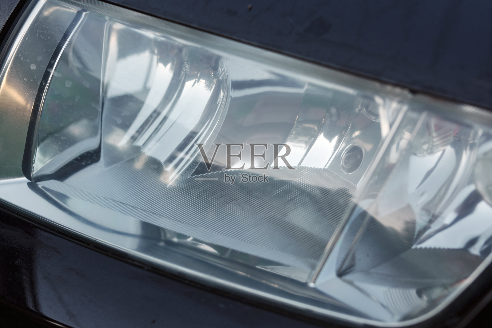 黑色车身上的抛光车头灯照片摄影图片