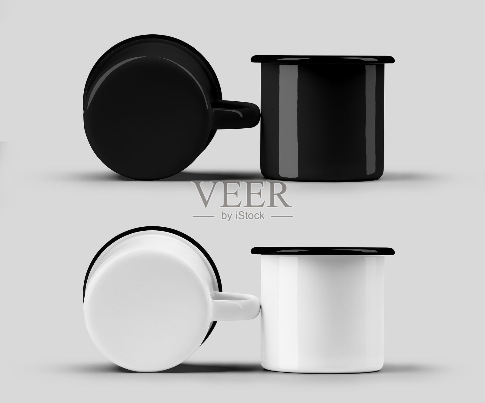 白色和黑色搪瓷杯的模板，黑色边缘，一个竖立，一个躺着，背景隔离。套装照片摄影图片