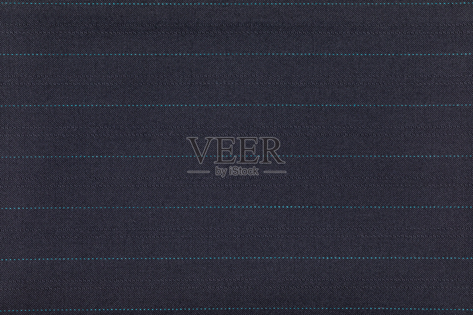 蓝色面料特写，带有细微的青绿色条纹照片摄影图片