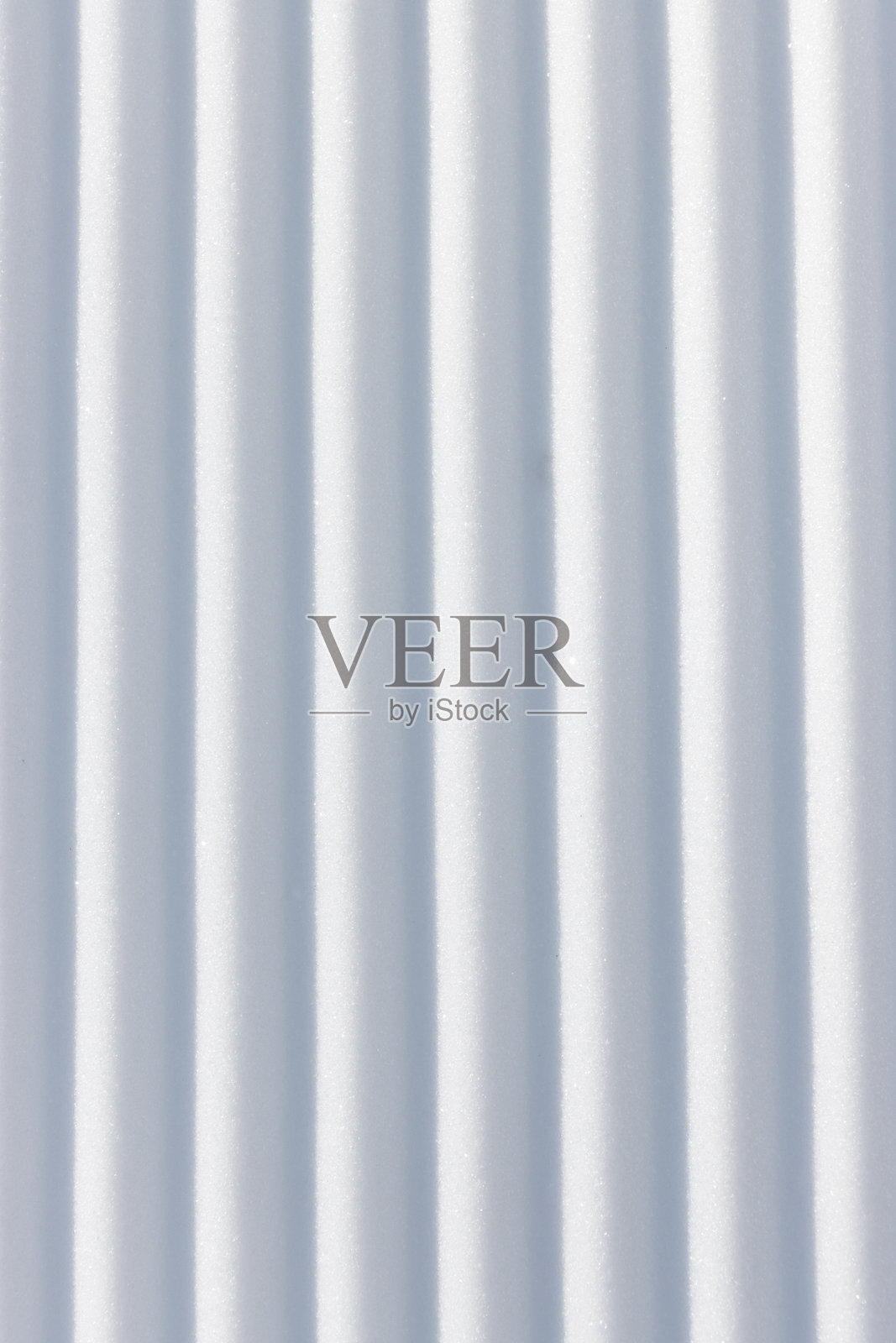 白雪表面纹理背景中的直立垂直线条沟槽照片摄影图片