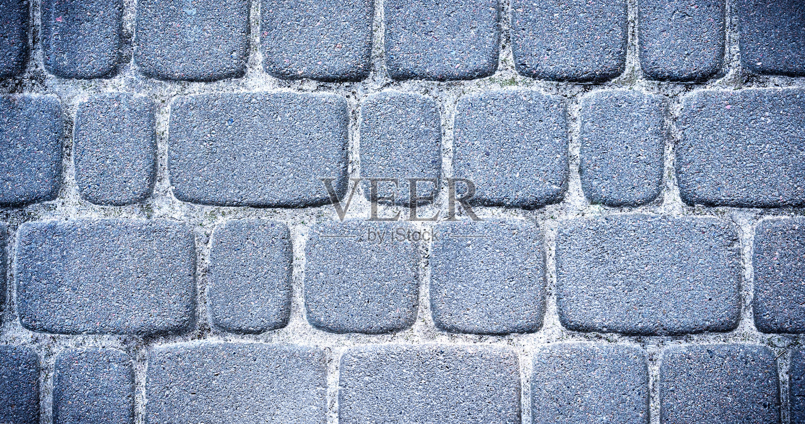 石质人行道的细致纹理。俯视图。选择性对焦。照片摄影图片