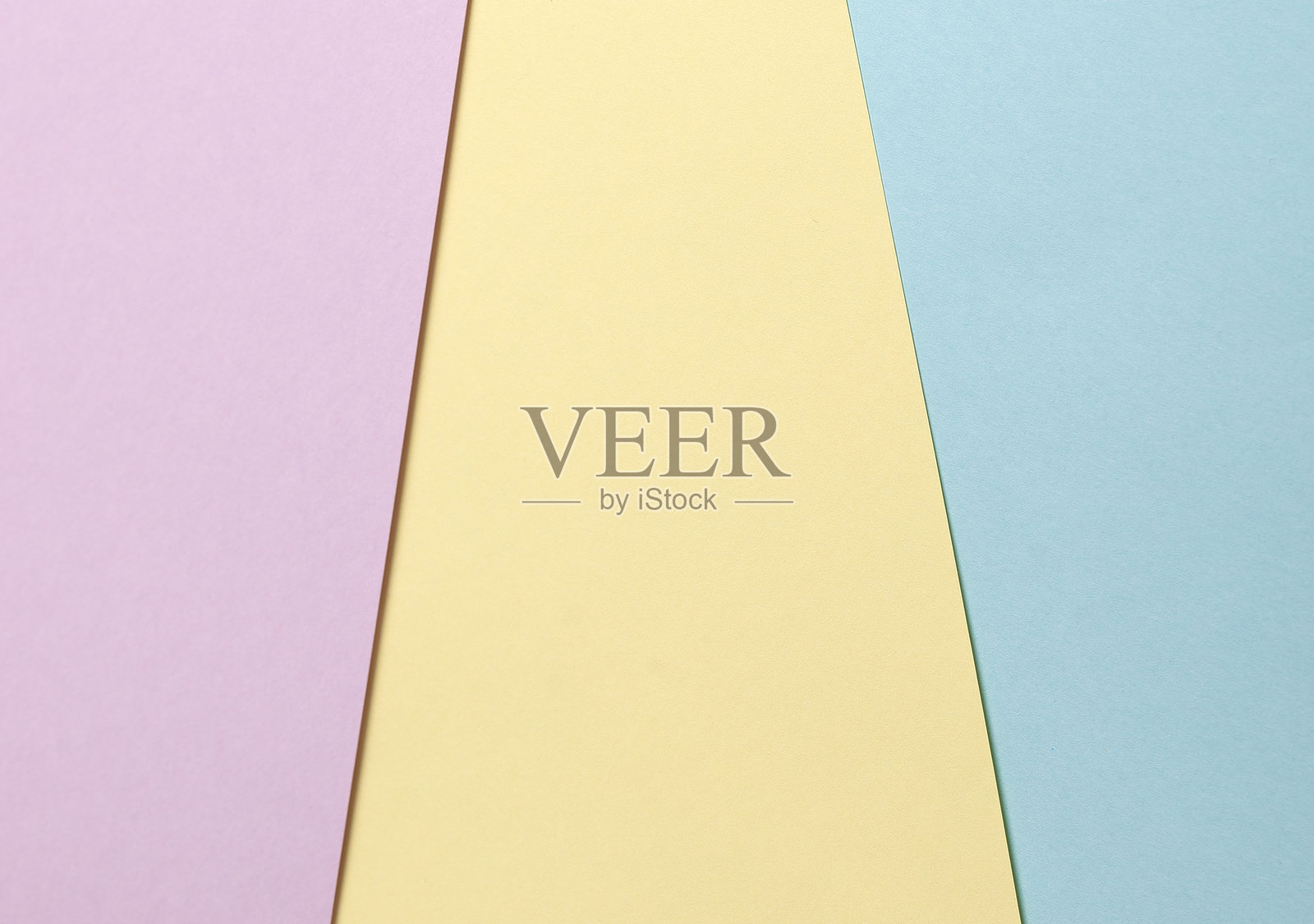 淡雅的抽象几何纸背景，呈现出薰衣草色、黄色和蓝色的色调。照片摄影图片