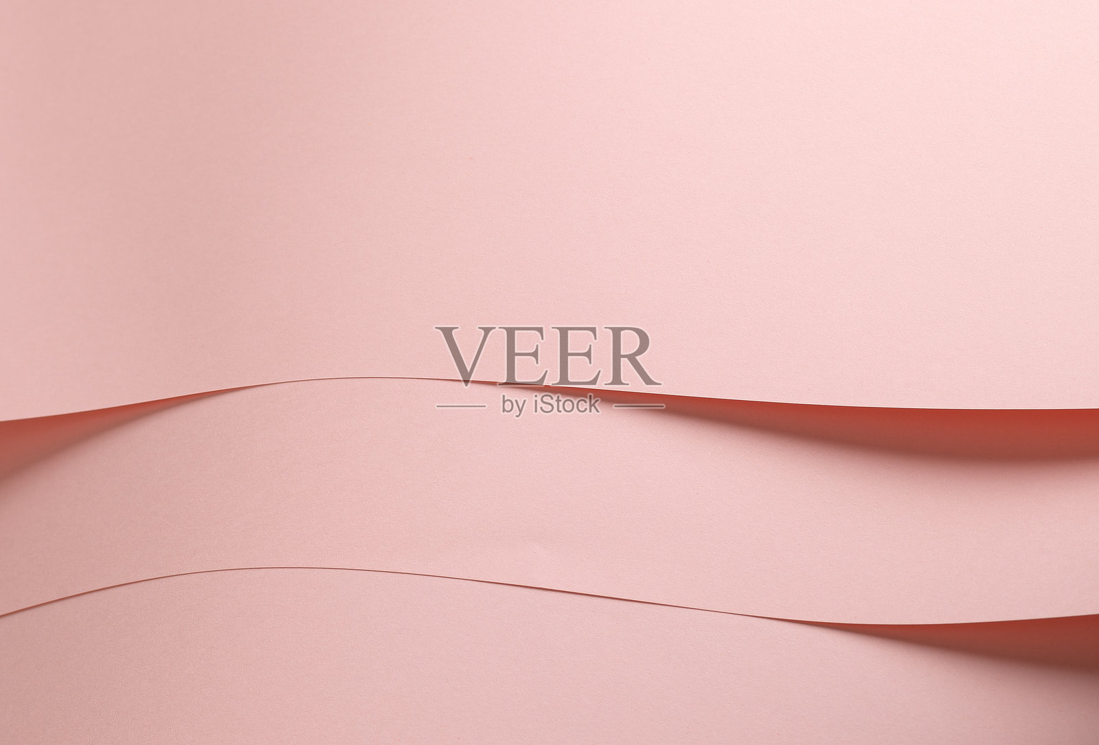 桃粉色纸张背景，表面光滑哑光，柔和的粉彩色调。细腻而优雅，照片摄影图片