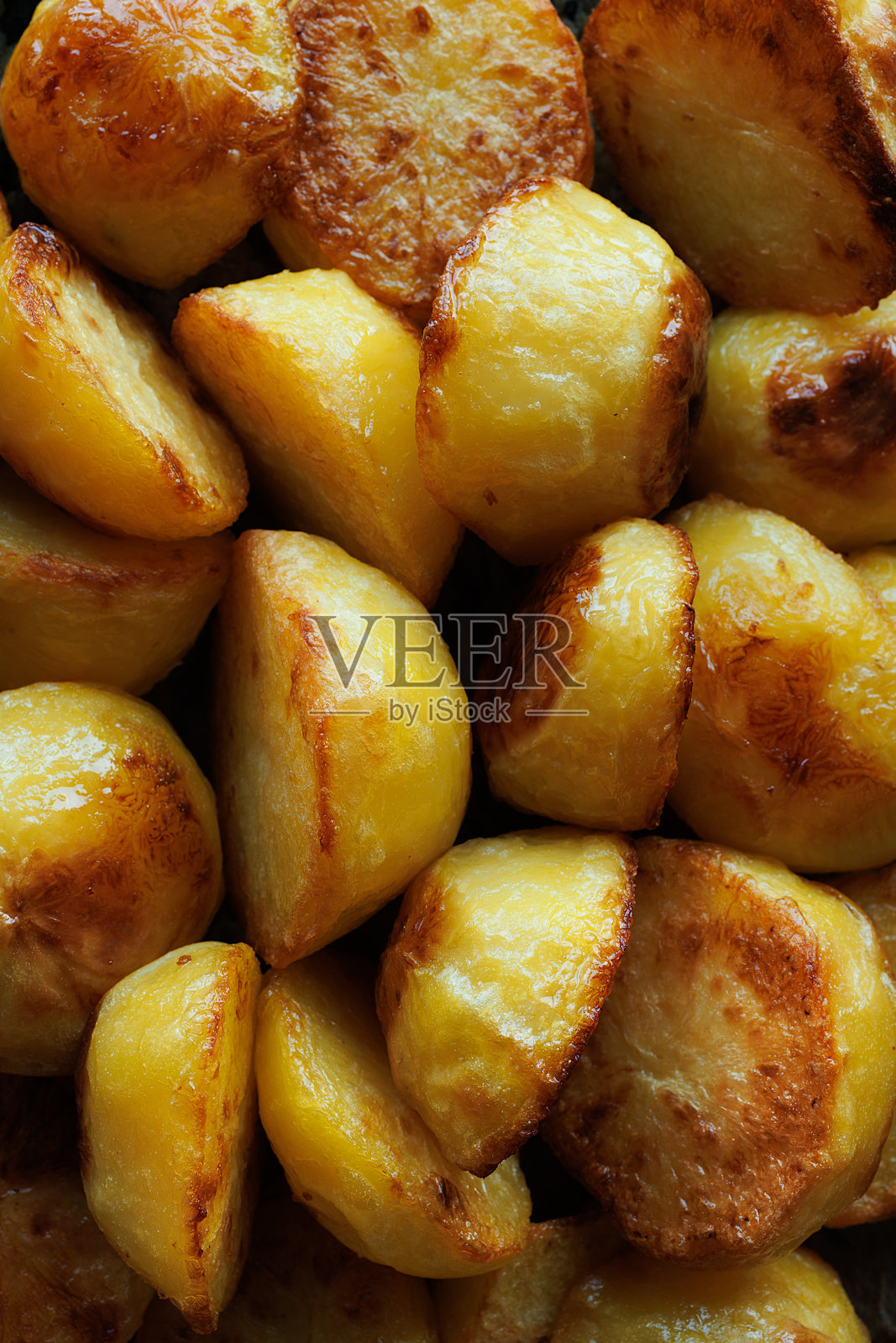 烤土豆片特写。照片摄影图片