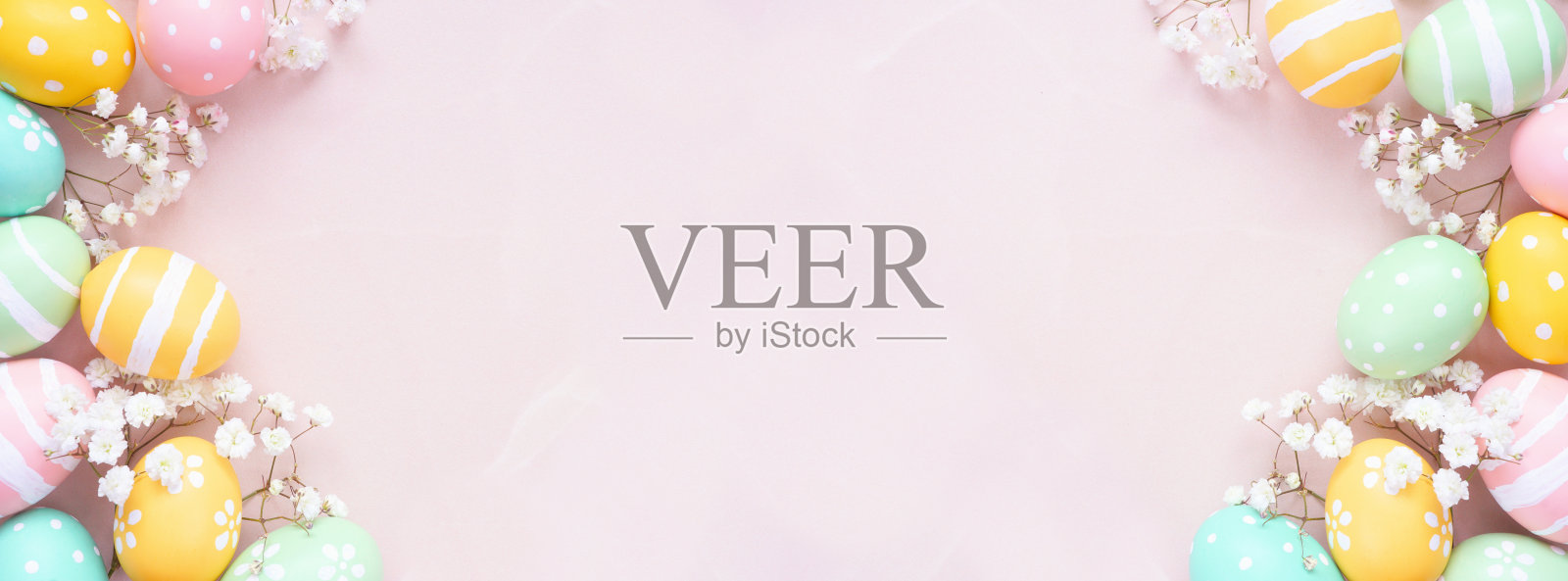 粉色石纹背景上，淡彩复活节彩蛋与白色春花双重边框照片摄影图片