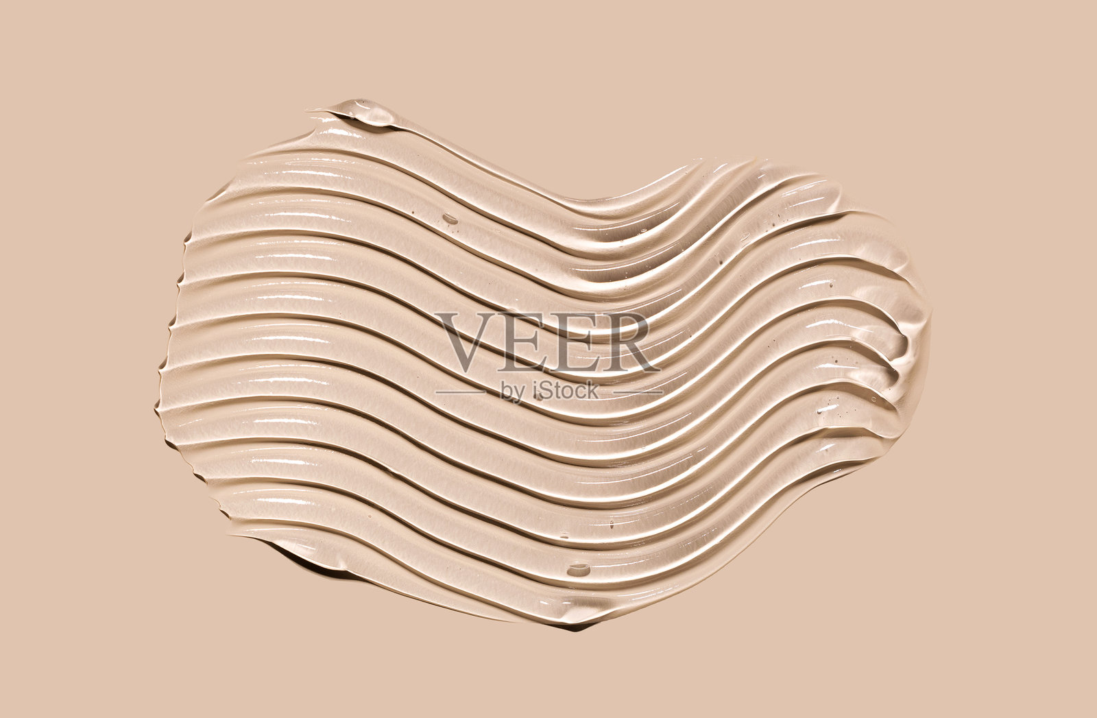 米色背景上的凝胶精华质地照片摄影图片