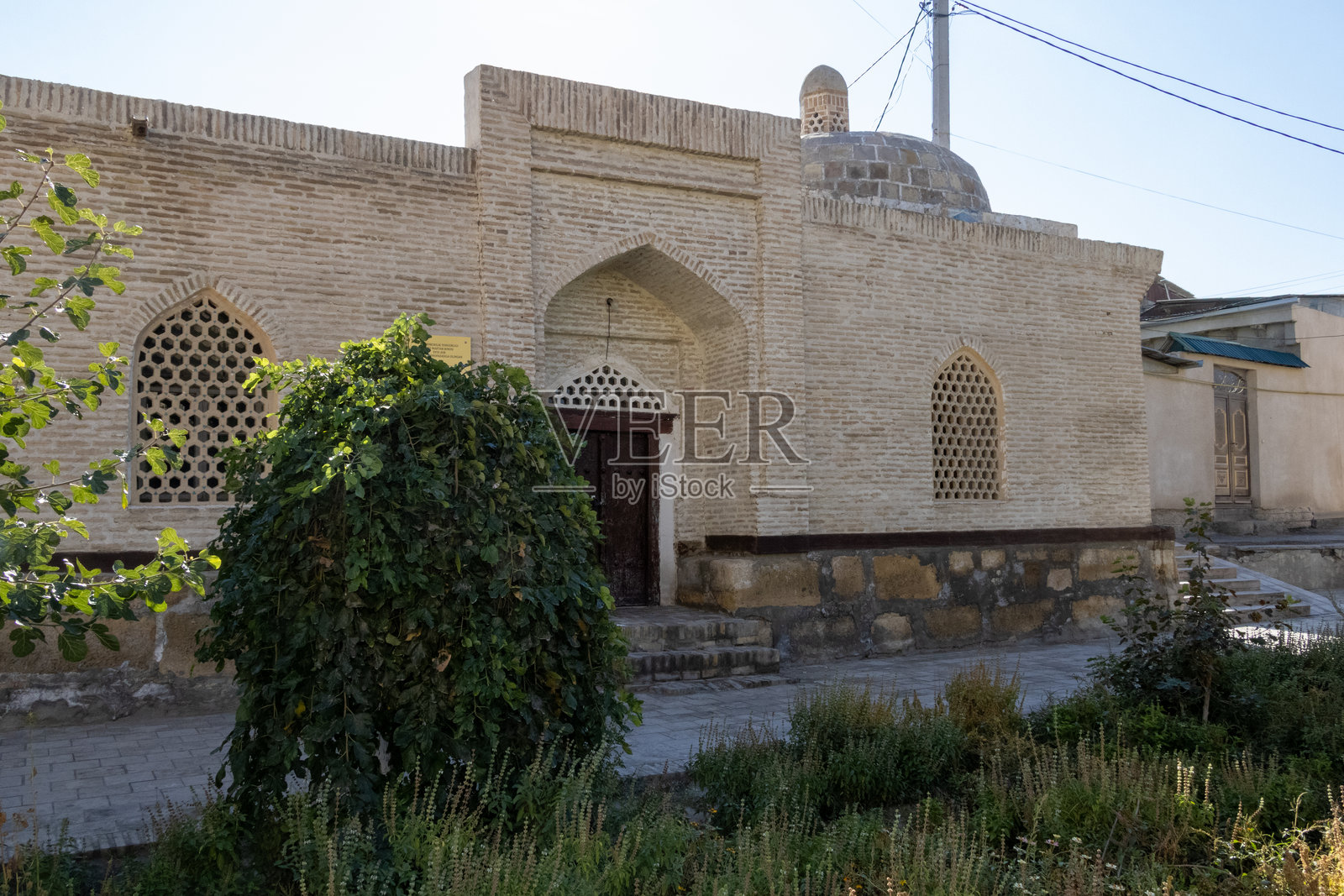 乌兹别克斯坦布哈拉 - 2024年10月17日：18世纪老校舍照片摄影图片