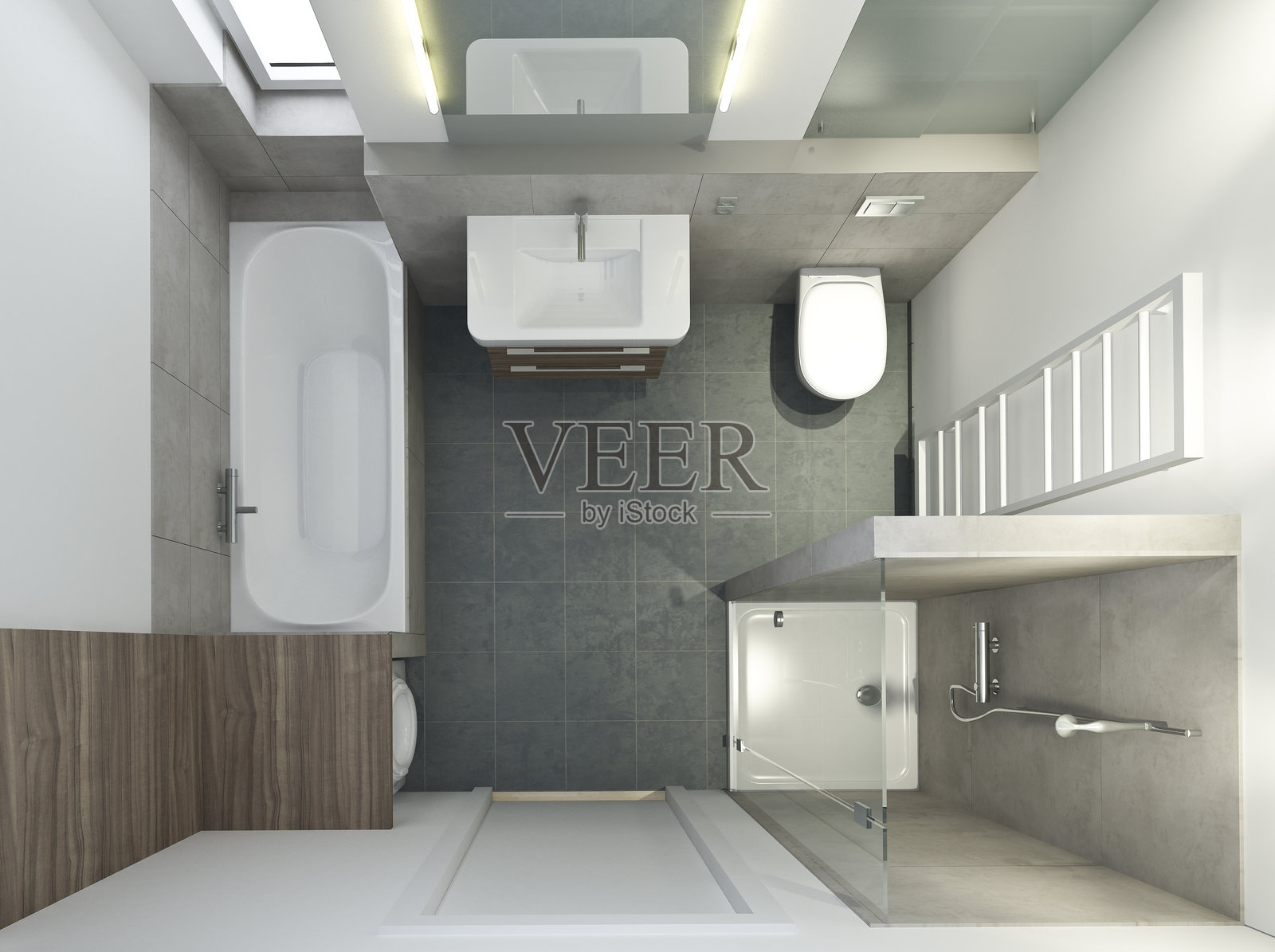 现代浴室的俯视图，配有浴缸和灰色瓷砖照片摄影图片