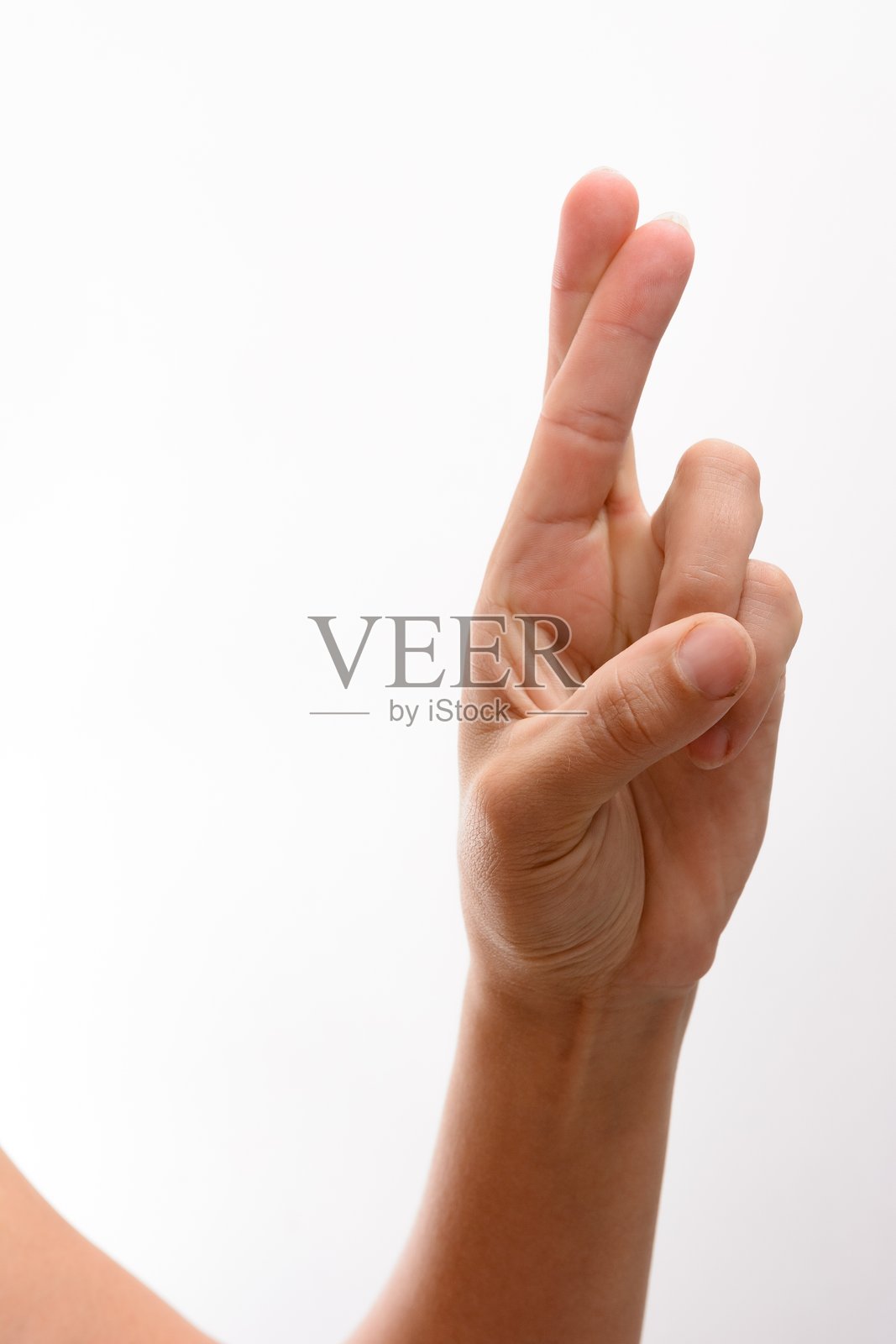 白色背景上的交叉手指照片摄影图片