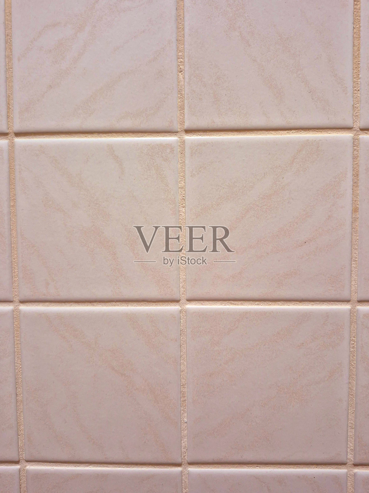 柔和米色的纹理陶瓷砖特写，十分引人注目照片摄影图片