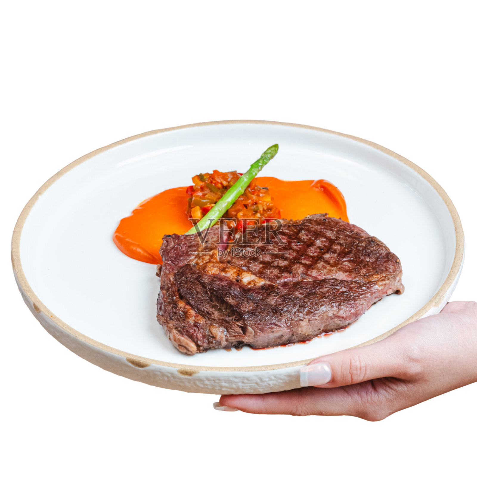 在室内环境中，近距离展示美味多汁的牛排，尽显美食的烹饪魅力。照片摄影图片