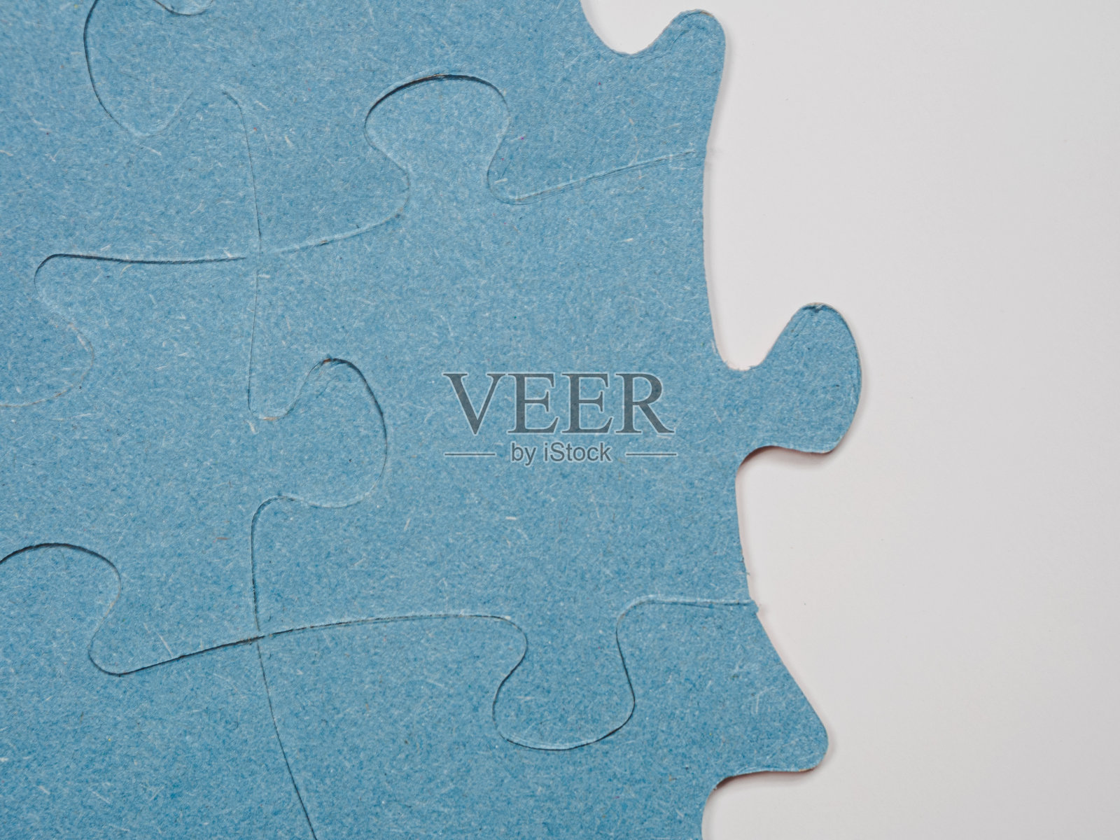 拼图创造了独特的背景，象征着团结与和谐，揭示了深刻的语义联系和情感。照片摄影图片