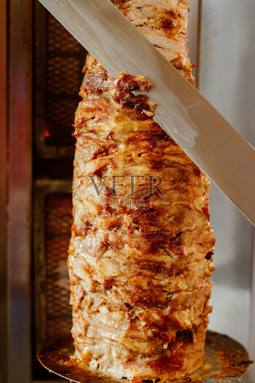 垂直旋转烤肉架与切片肉照片摄影图片