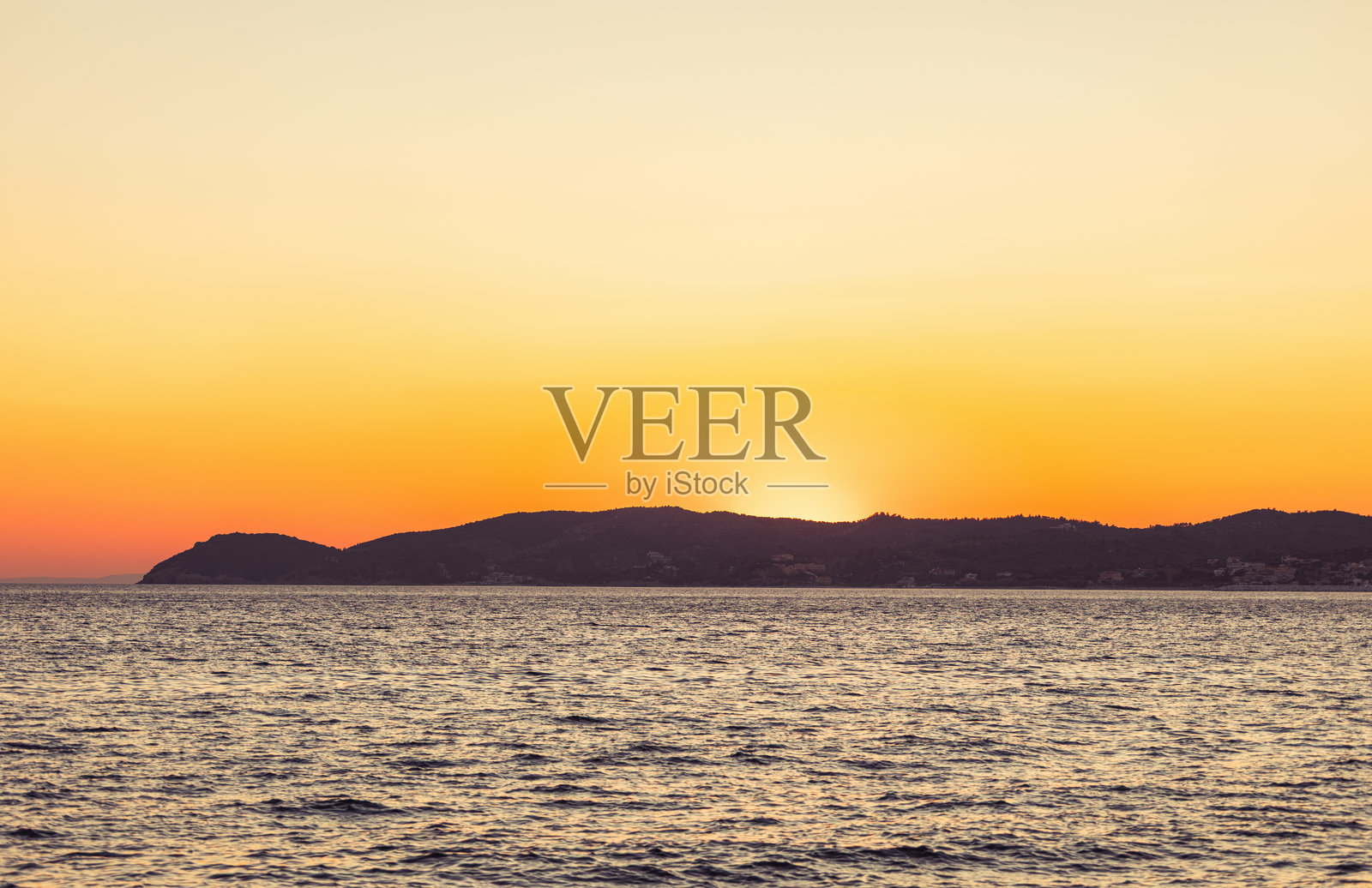 希腊岛屿上的美丽日落照片摄影图片