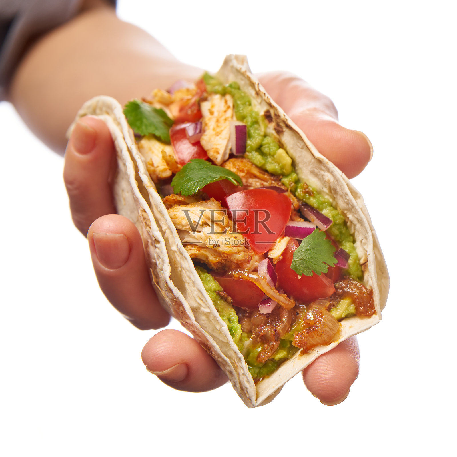 手持美味鸡肉塔可，采用新鲜、美味的食材，供大家享用照片摄影图片
