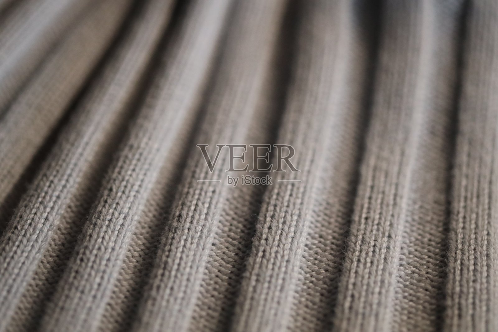 棕色毛衣的特写，展现纹理和细节照片摄影图片