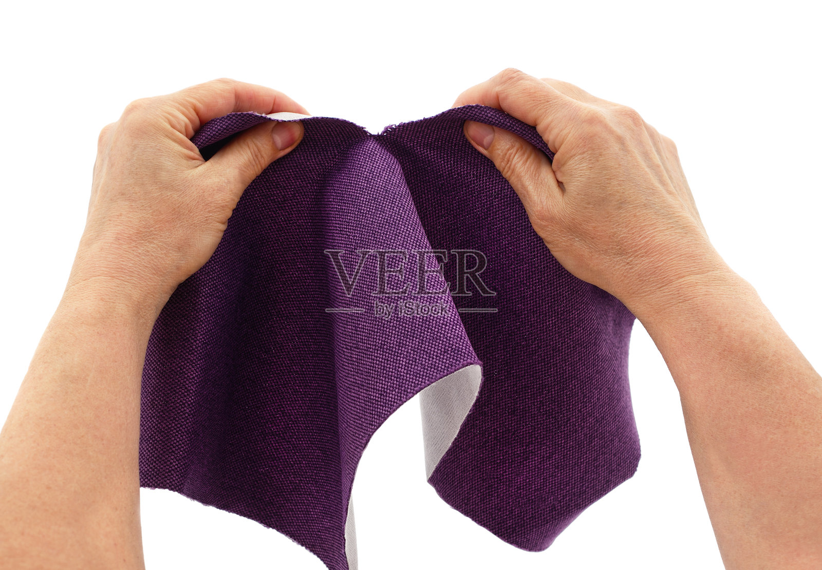 手撕布料。照片摄影图片