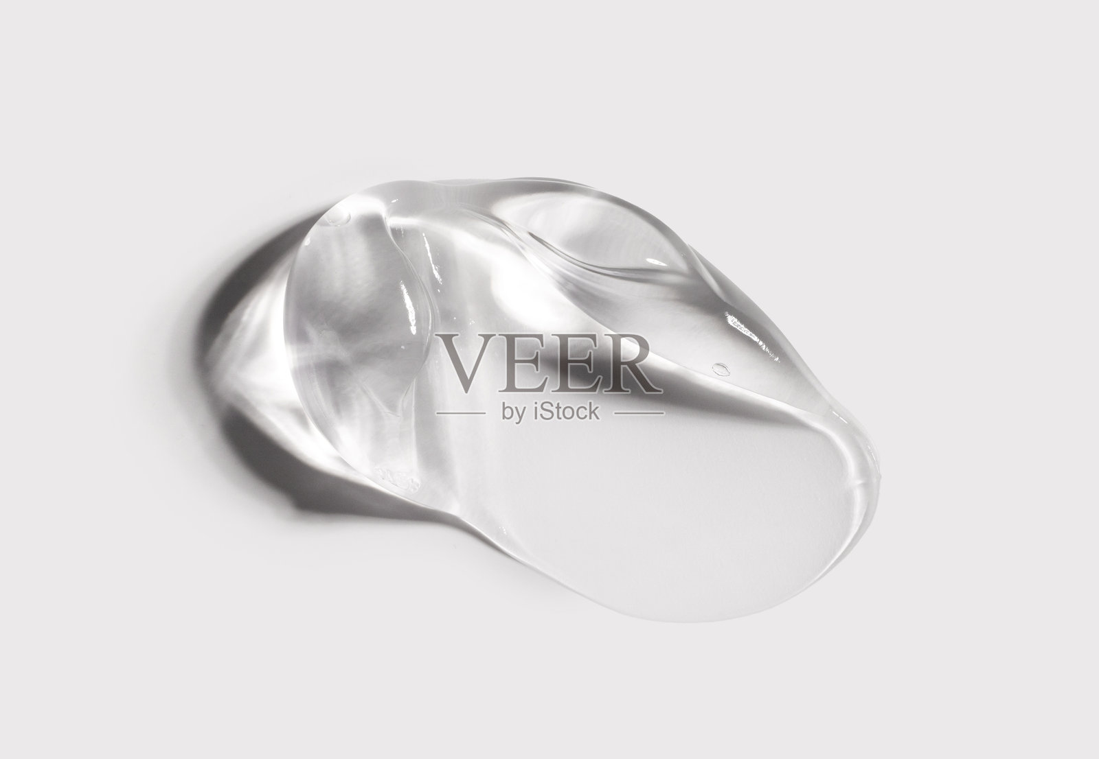 浅色背景上的凝胶精华质地照片摄影图片