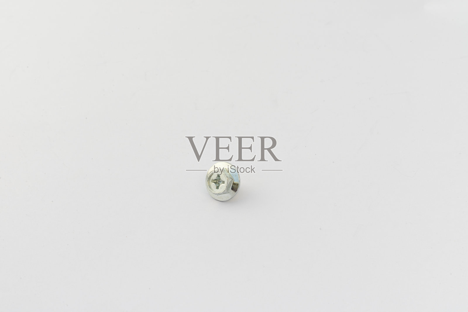 白色背景上的单个六角头螺丝照片摄影图片