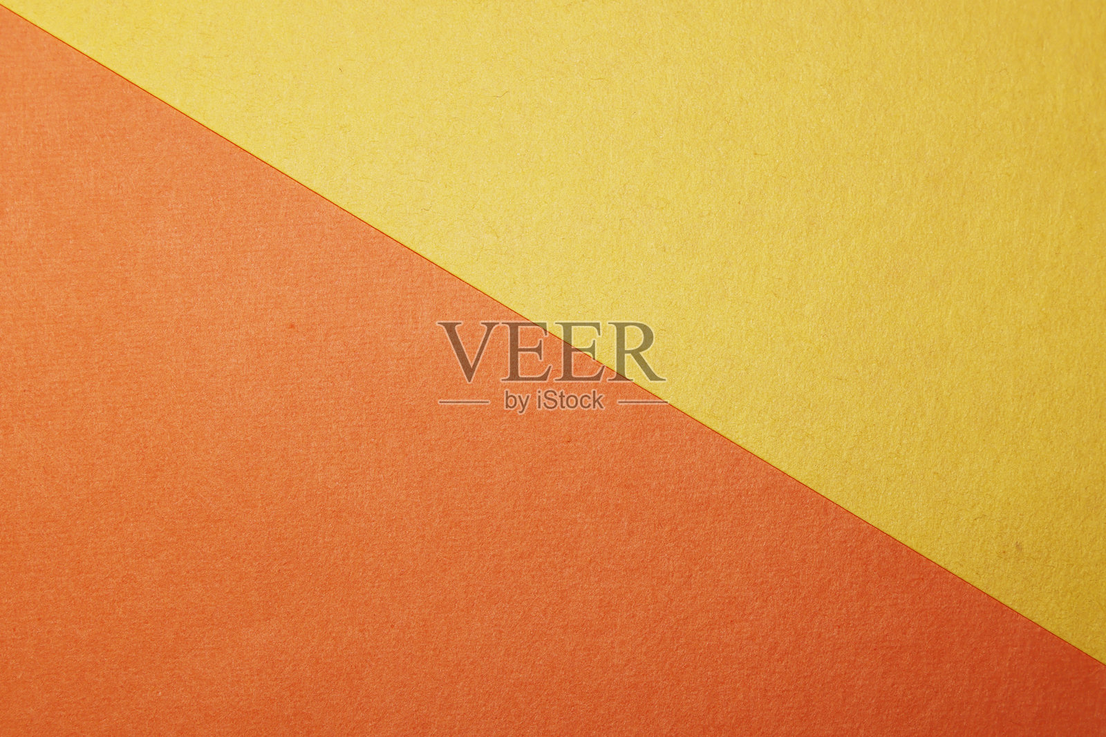橙色和黄色的纸张背景。照片摄影图片