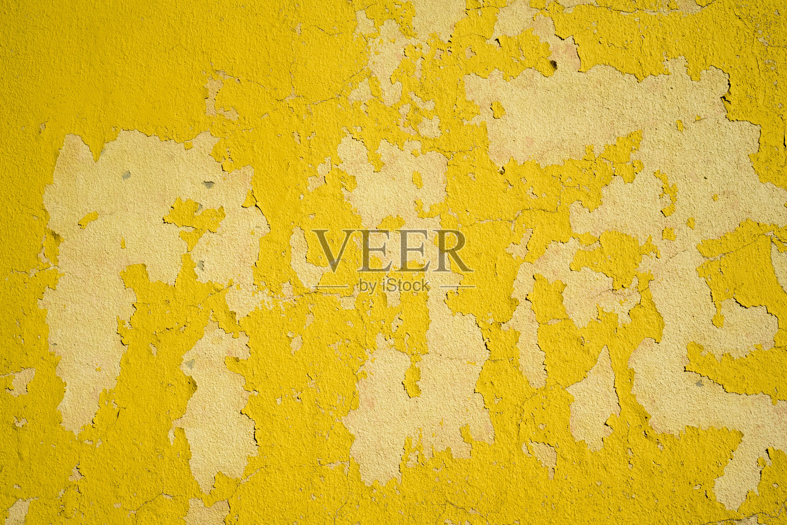黄色墙壁上剥落的油漆细节照片摄影图片