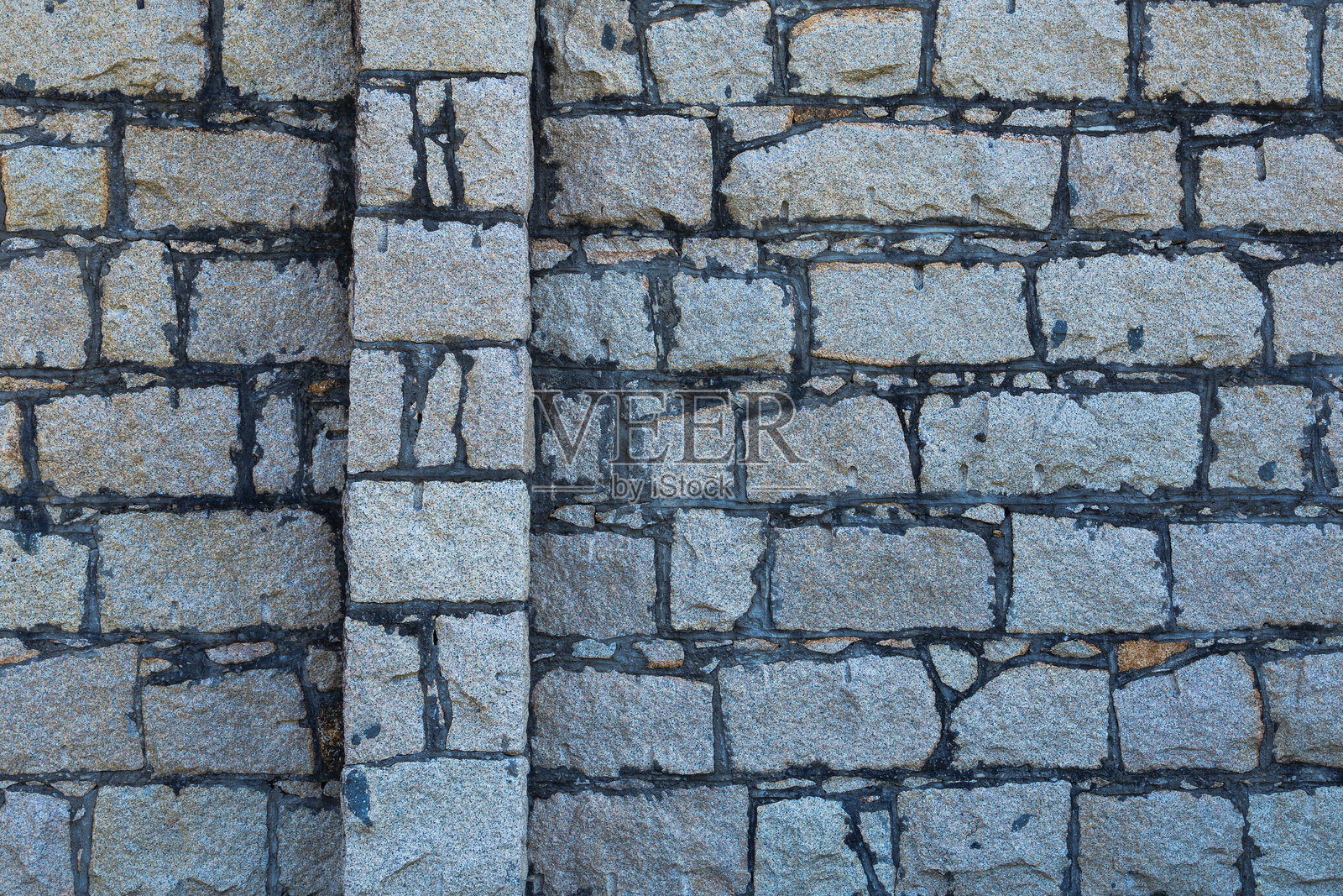 历史悠久的砂岩砖墙磨损纹理背景。照片摄影图片