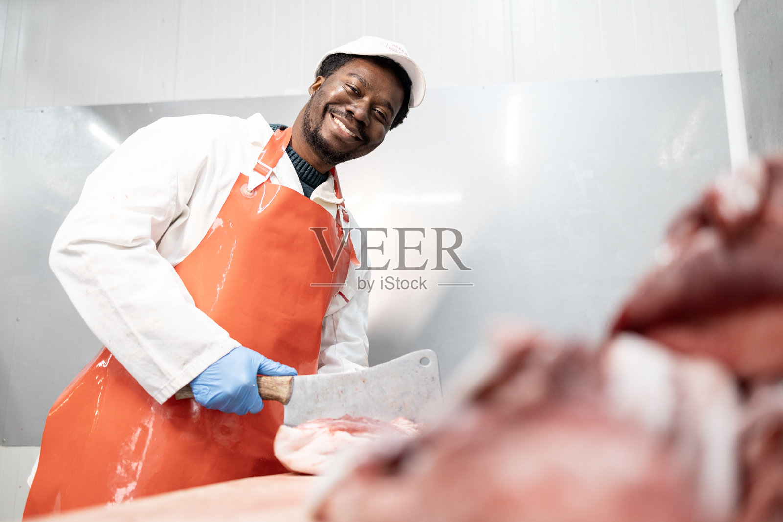 肉店工作人员。照片摄影图片