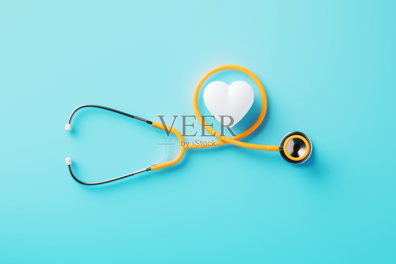 蓝色背景上的橙色听诊器和白色心形图案照片摄影图片