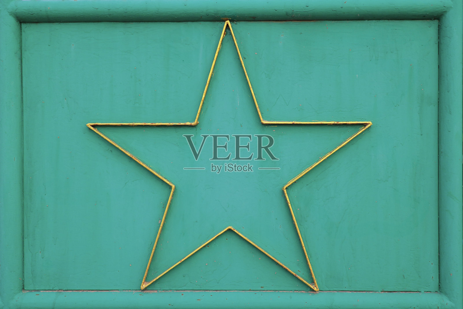 古董风格的绿色和金色背景纹理，带有星星。照片摄影图片